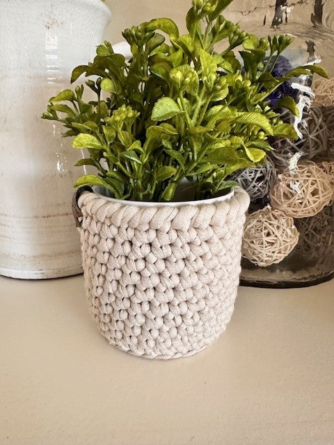 Faux plants with crochet pot covers