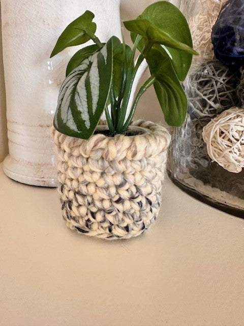 Faux plants with crochet pot covers