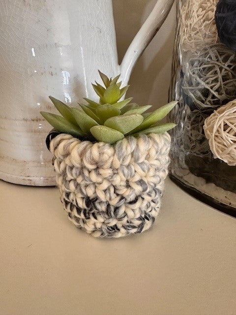 Faux plants with crochet pot covers